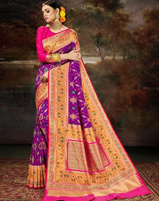 Vibrant Purple and Orange Silk Saree with Traditional Ikat Patterns